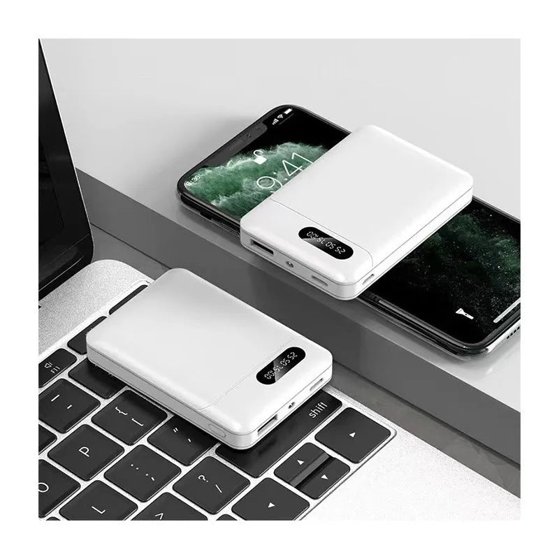 Black and white portable power bank with multiple capacity options and USB ports on a grey background.