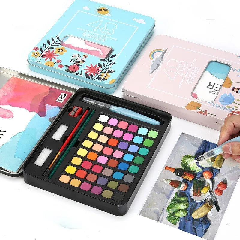 48 colour solid watercolour paint set showing compartmentalised layout with Black Knight, Girl Pink and Sunshine Blue shades