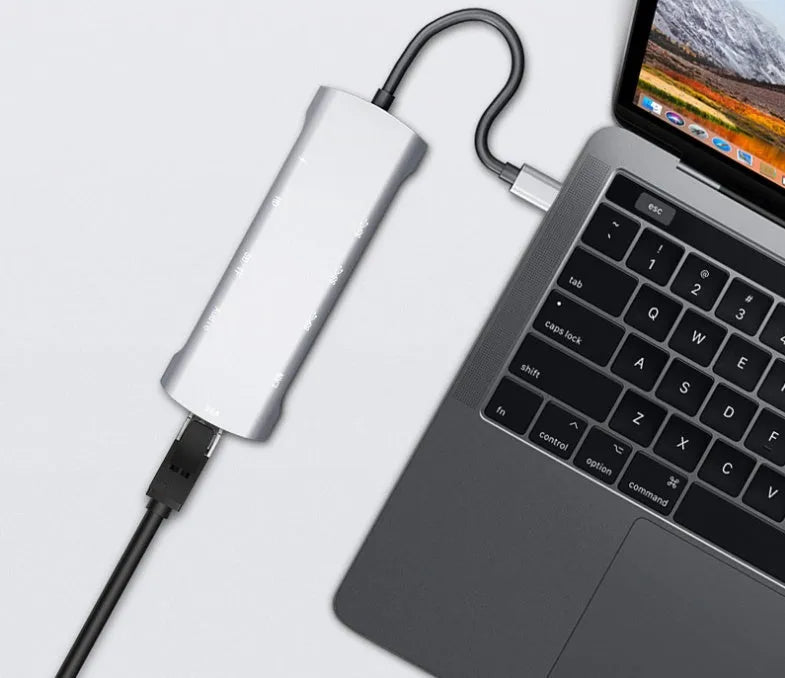 Grey aluminium alloy USBC docking station with HDMI, VGA, and USB ports