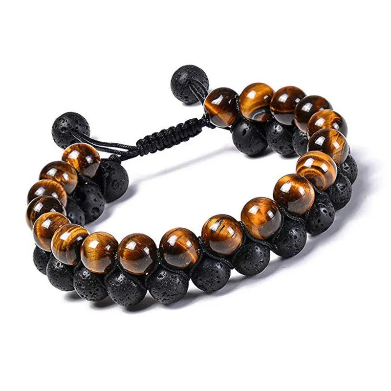 Matte black agate tiger eye bead couple bracelets with geometric design on a neutral background.