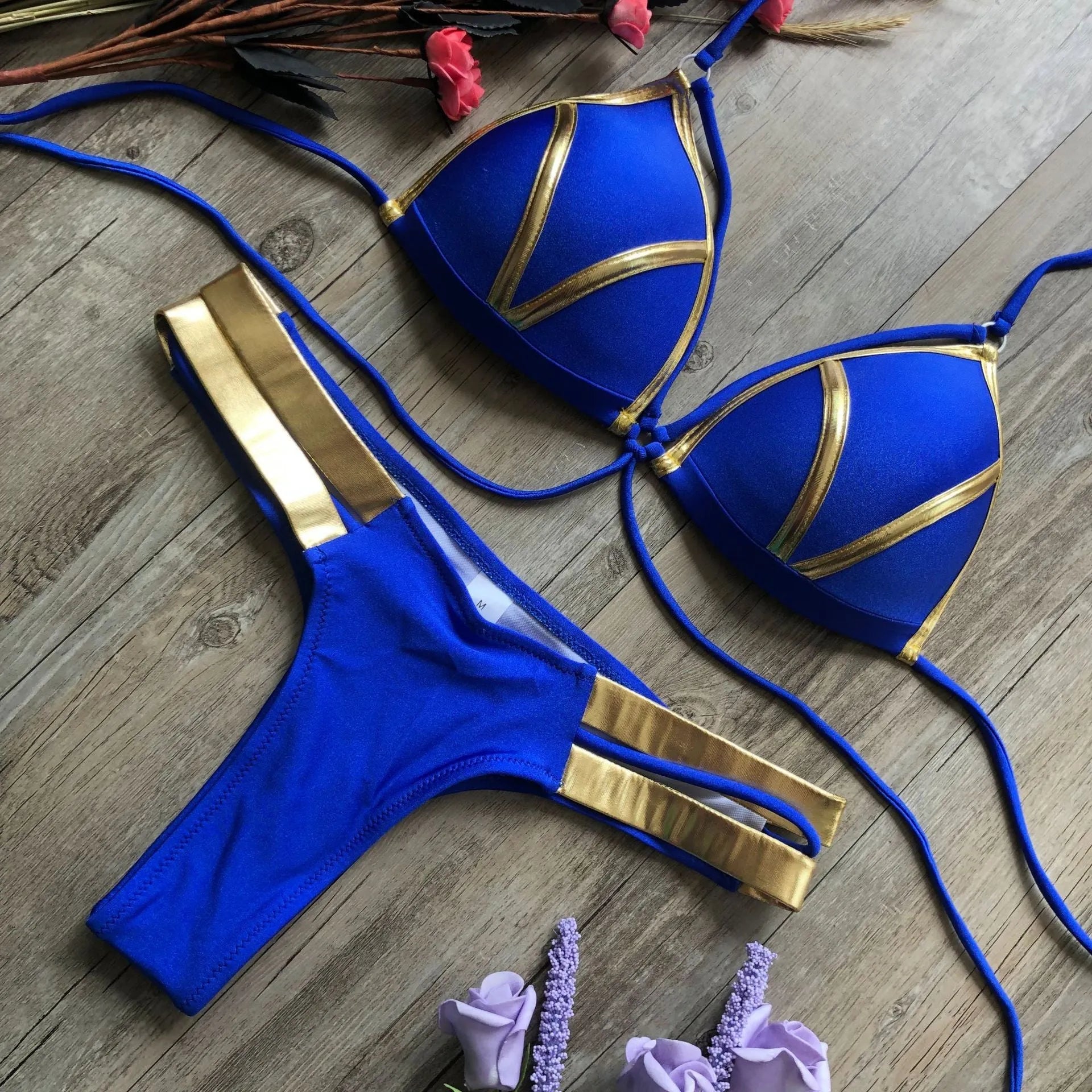 Women's bronzing bikini top and bottom set in leopard print with non-wired triangle cups.