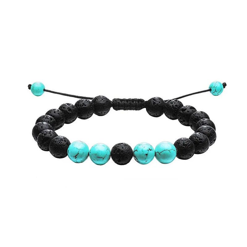Matte black agate tiger eye bead couple bracelets with geometric design on a neutral background.