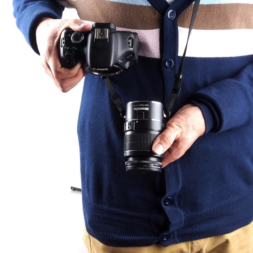 Aluminium camera lens flipper holder with cotton strap for quick lens changes on DSLR.