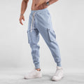 Men's loose fit multi-pocket cotton trousers with ankle ties in apricot colour