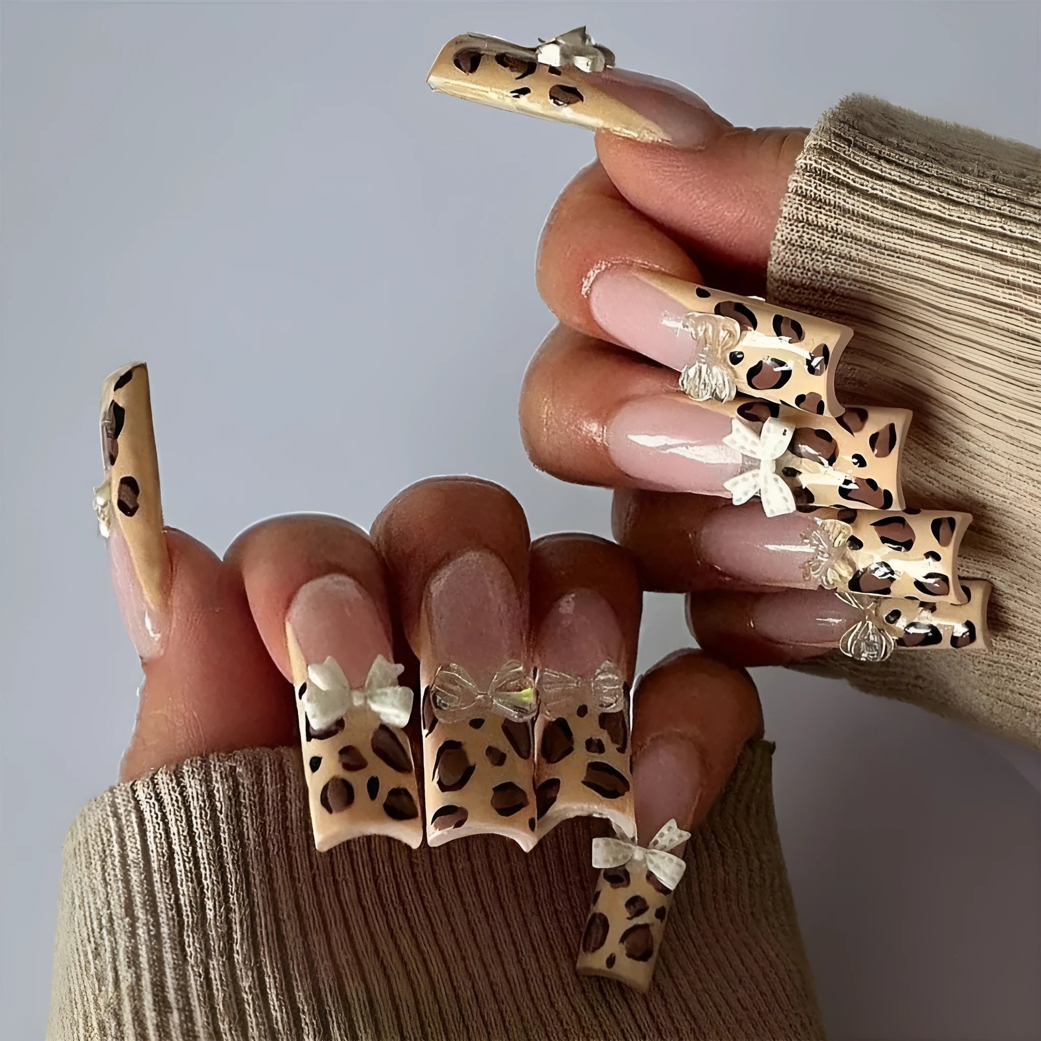 Leopard print butterfly designs on plastic false nails in WM296 colour for ladies manicure