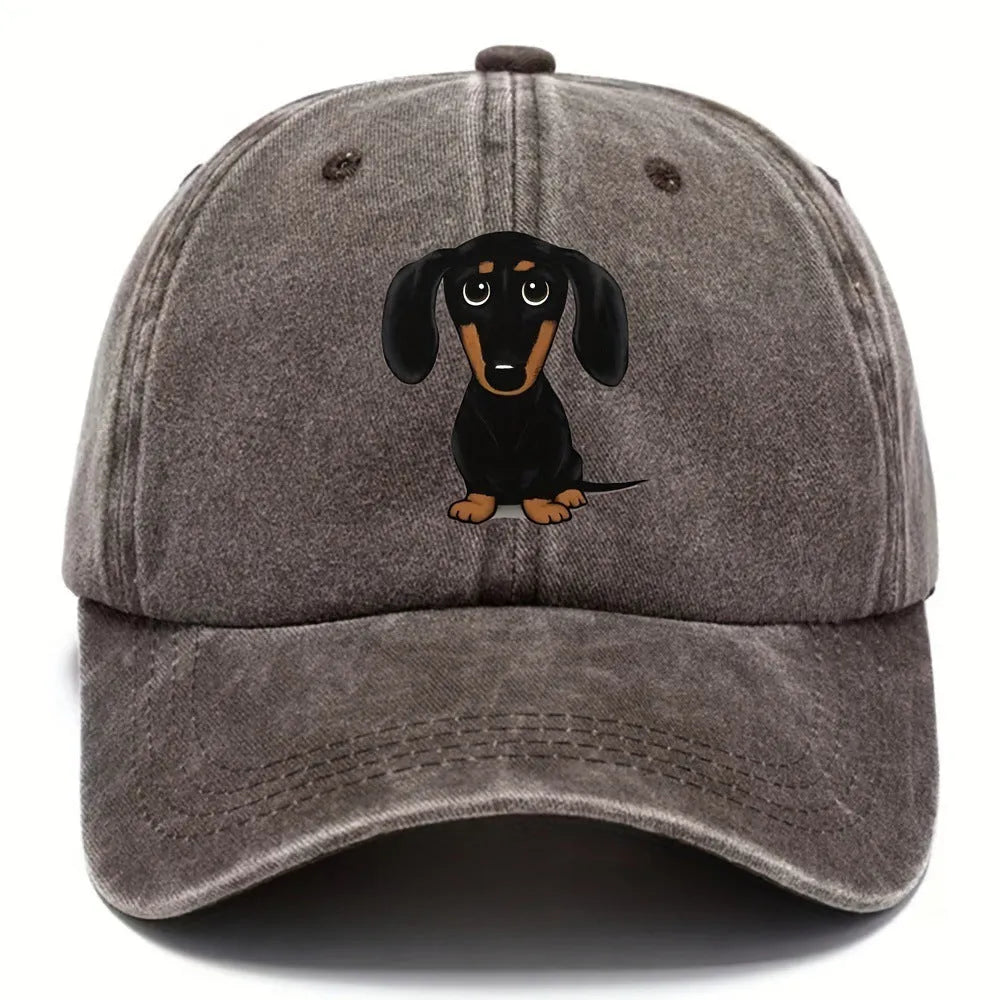 Retro washed blue cotton baseball cap with an embroidered brown dachshund design on the front.