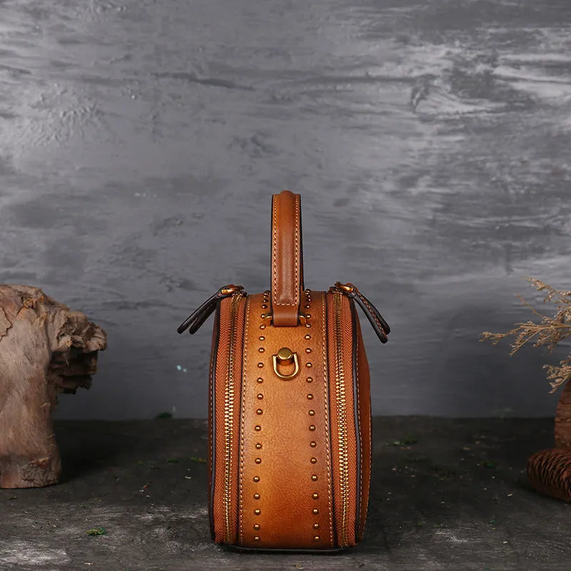 Vintage cowhide suede leather handbag showing internal organisation compartments including ID pouch and mobile phone section