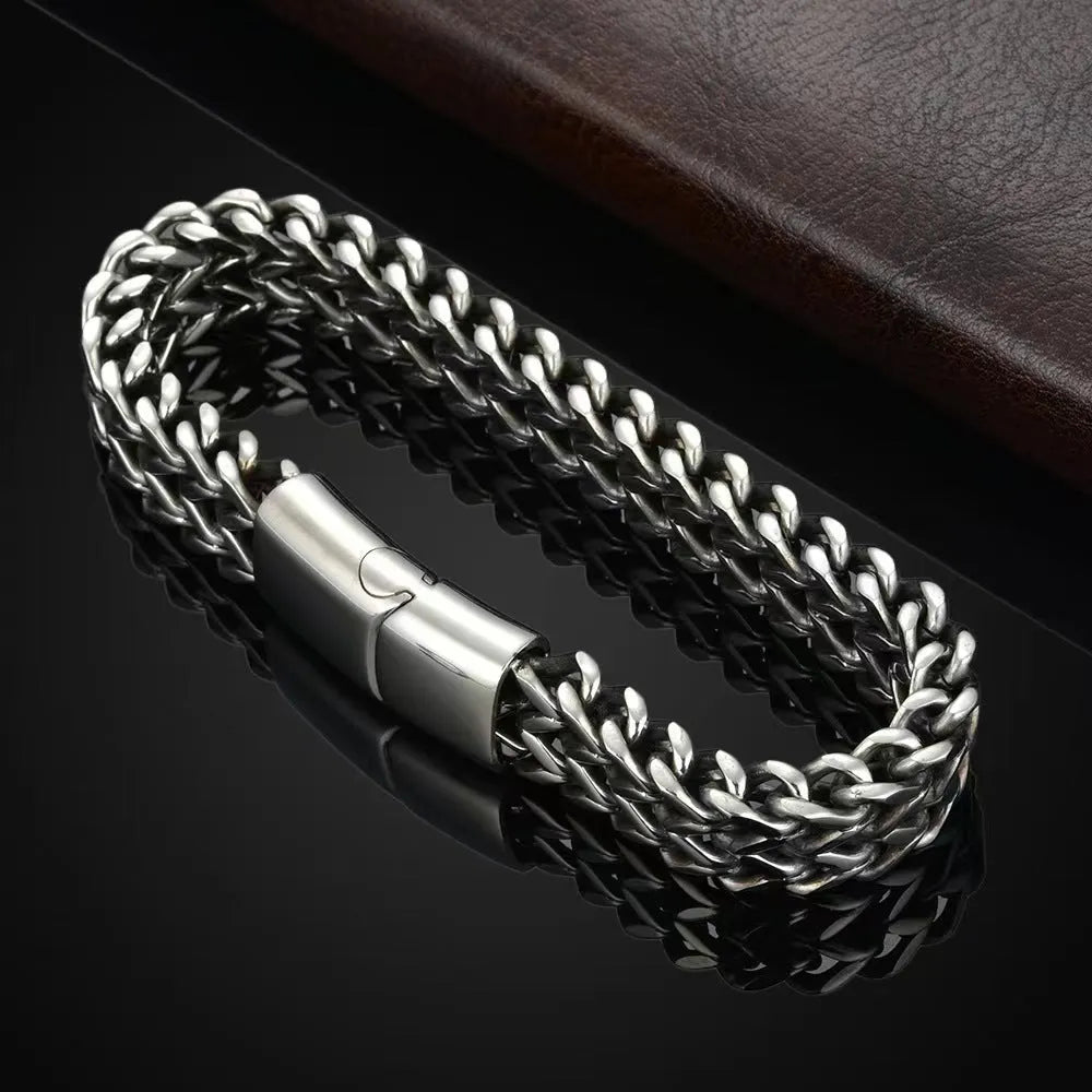 Silver geometric stainless steel men's bracelet showing front and back design details