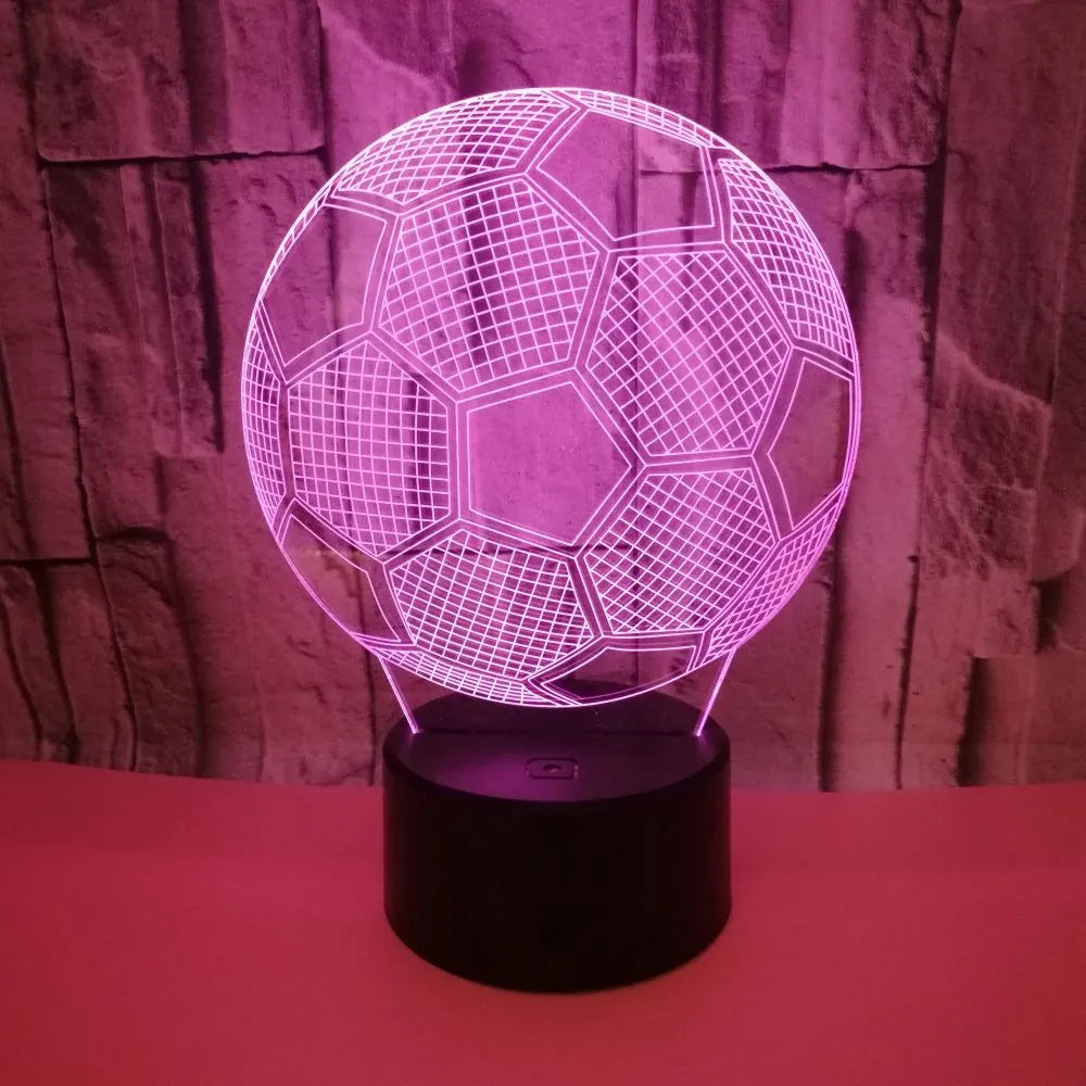 3D football shaped night light with colourful LED illumination on a black ABS base.