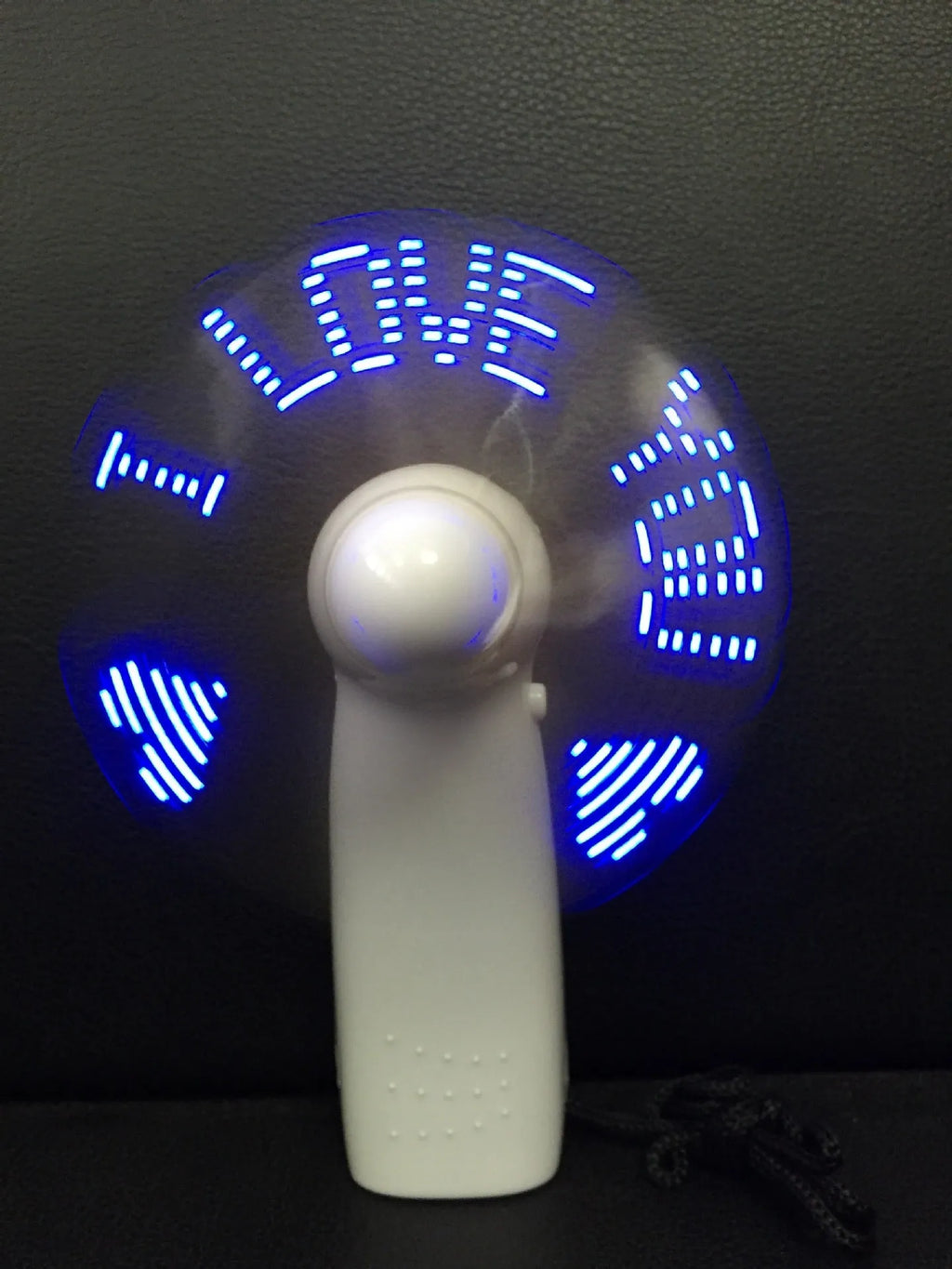 White handheld mini fan with LED I love you pattern in blue and red colours