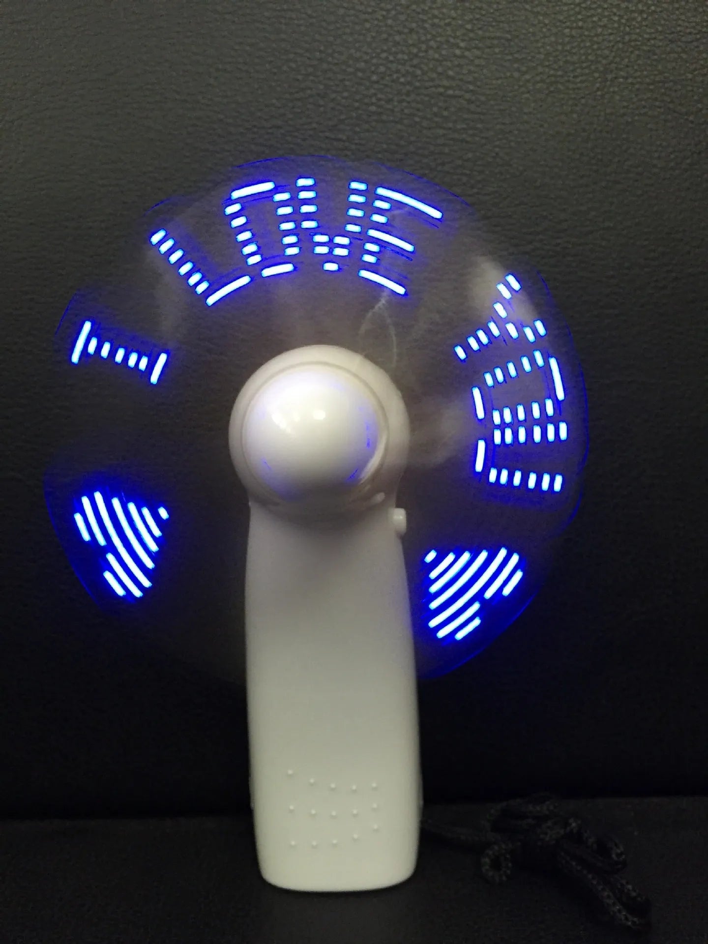 White handheld mini fan with LED I love you pattern in blue and red colours