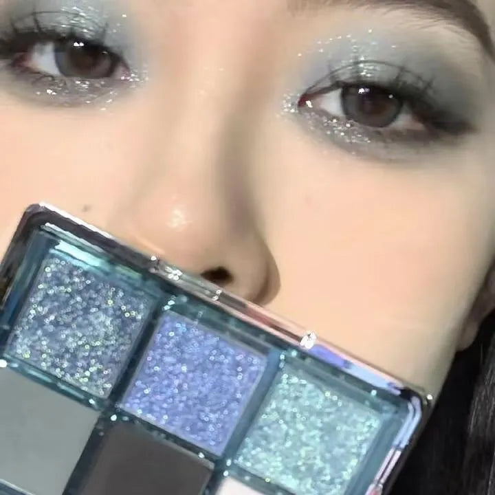 MUGELEEN nine-colour eye shadow palette 08 showing low saturation blue and earth tones with matte shimmer finishes