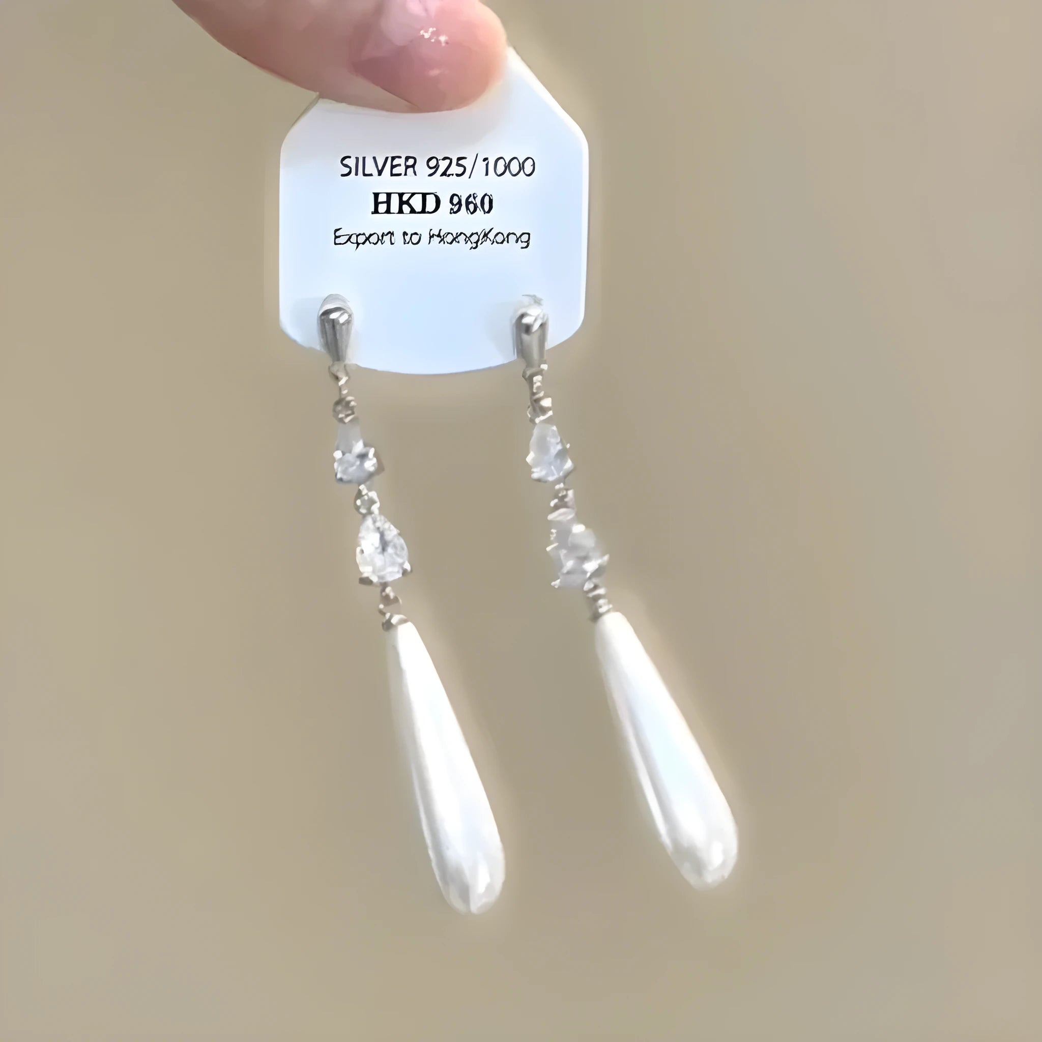 Geometric alloy clip-on earrings with rhinestone stars, a heart design, and dangling tassels.