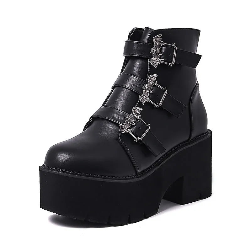 Black women's punk style Martin boots with bat buckle and side zip closure