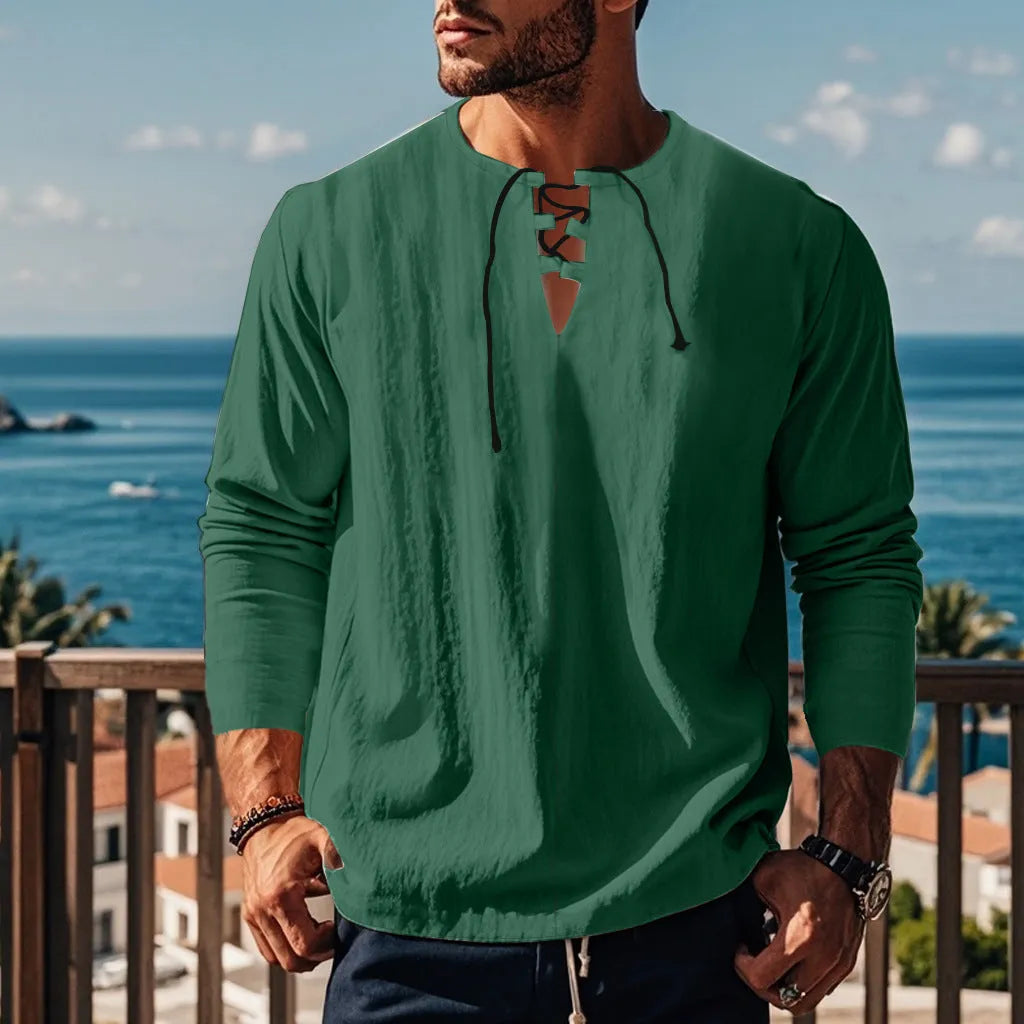 Cotton linen beach ruff shirt in a loose pullover style on a hanger.