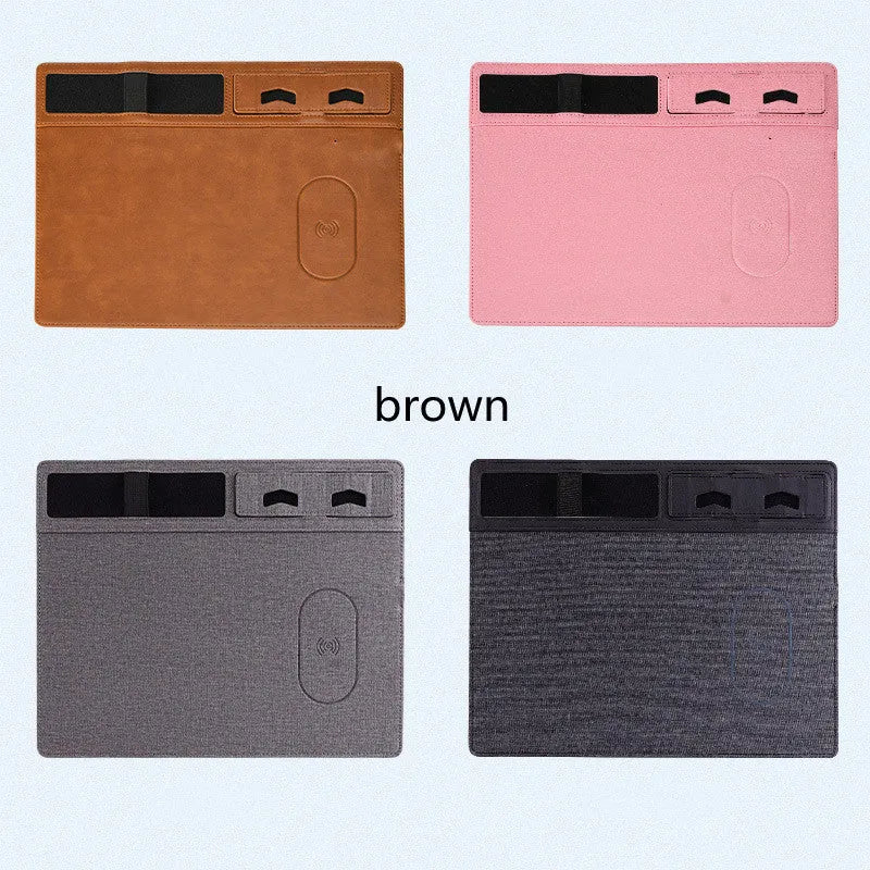 Pink wireless charging mouse pad with phone holder on a desk, dimensions 320mm by 260mm.