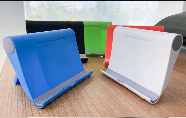 Black PE folding mobile phone stand with soft rubber grip in open position holding a smartphone