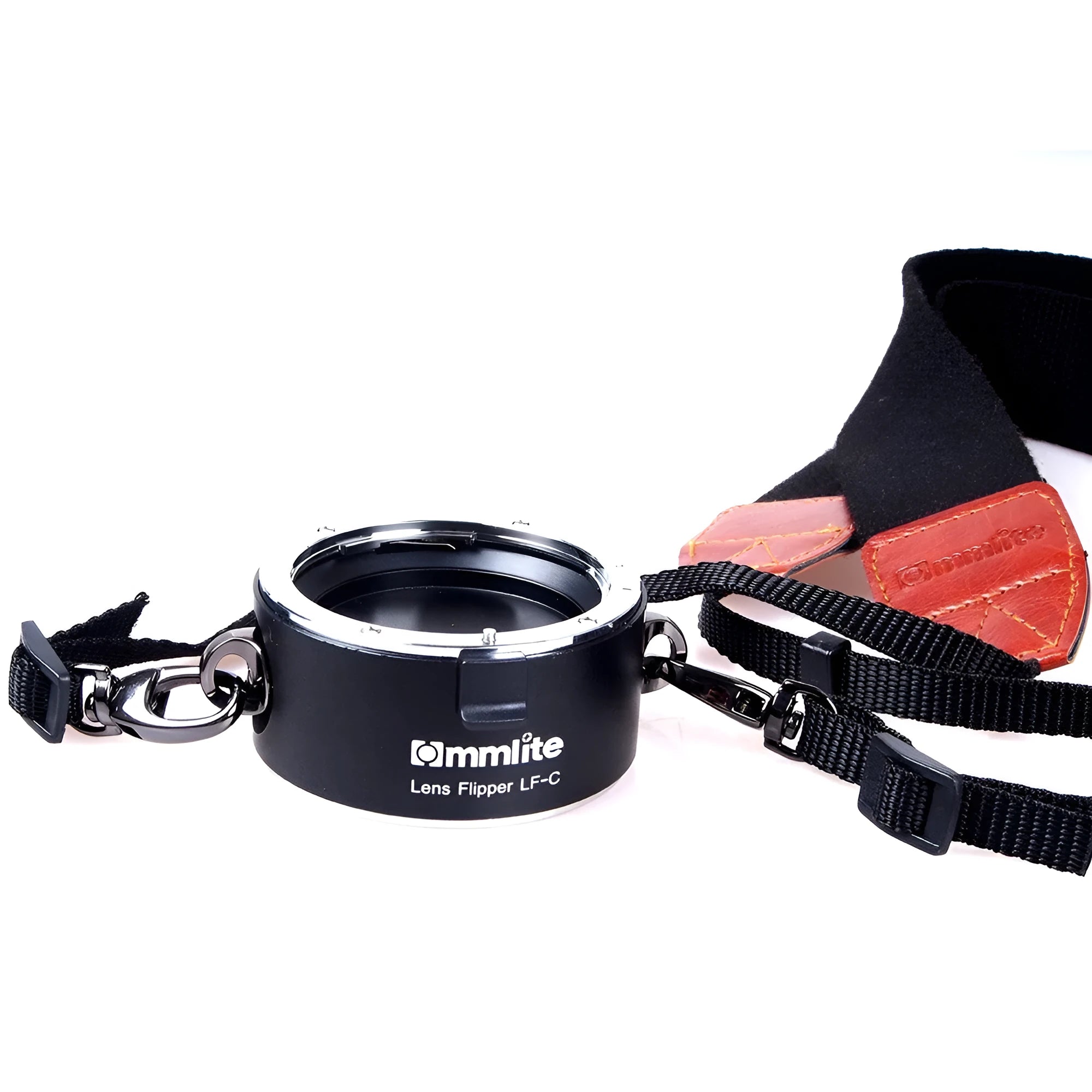 Aluminium camera lens flipper holder with cotton strap for quick lens changes on DSLR.