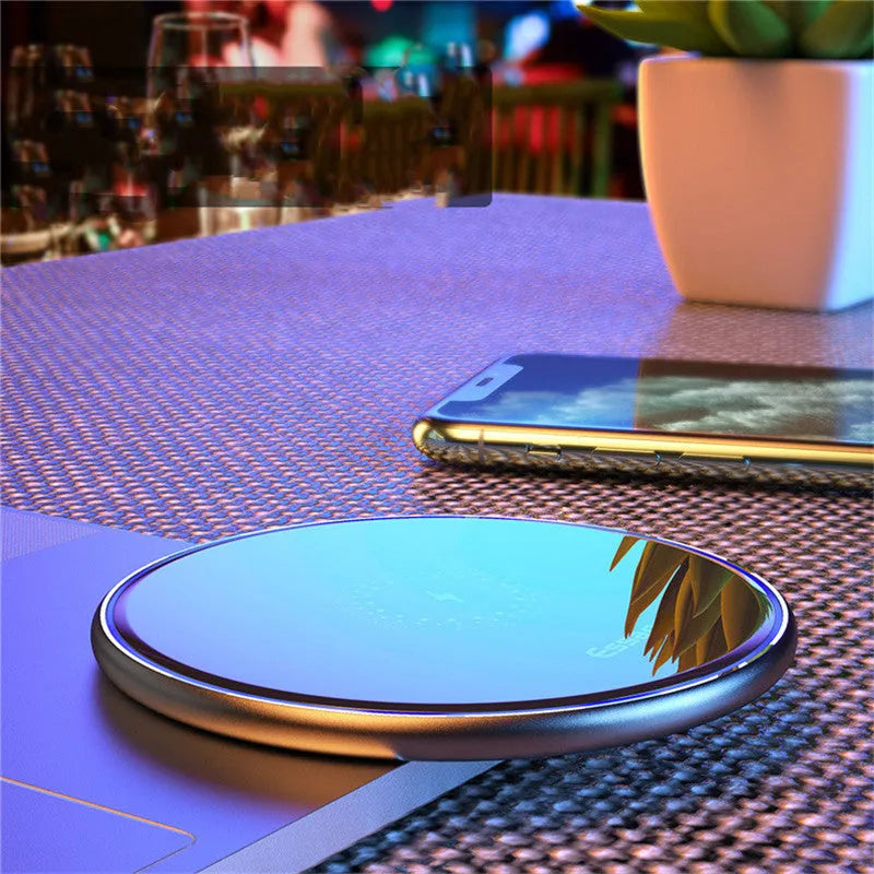 Black aluminium wireless charging pad with LED indicator lights for Qi-compatible phones