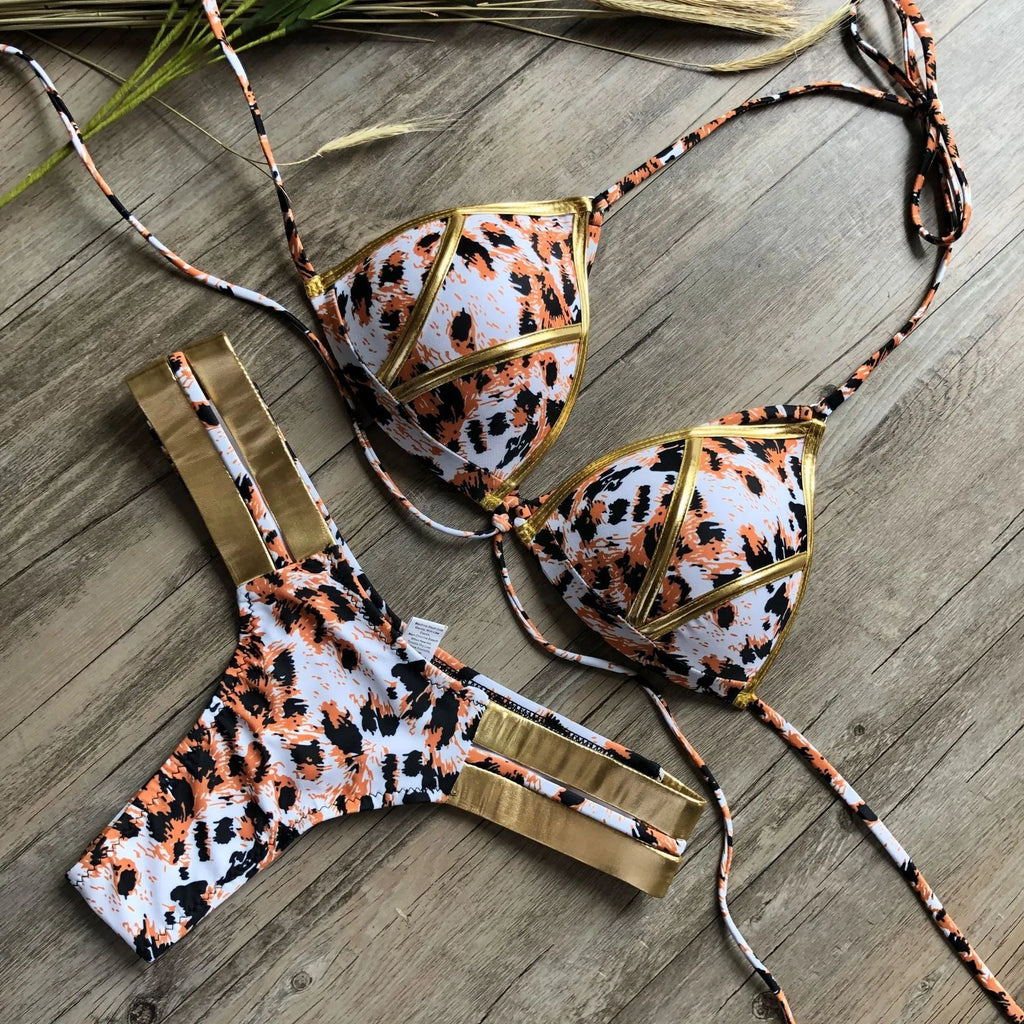 Women's bronzing bikini top and bottom set in leopard print with non-wired triangle cups.