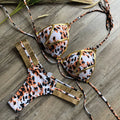 Women's bronzing bikini top and bottom set in leopard print with non-wired triangle cups.