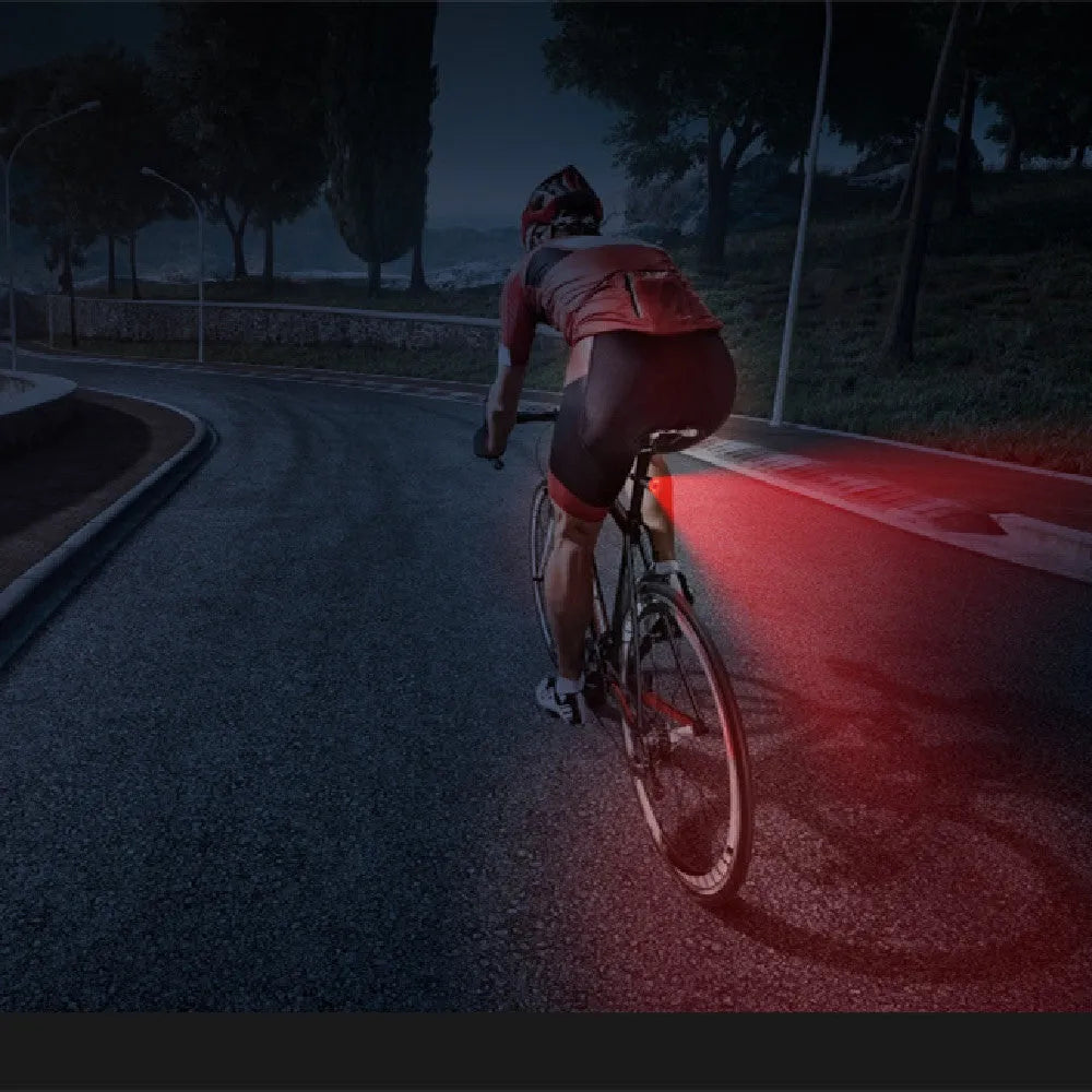 Black USB rechargeable smart brake sensing bicycle taillight with aluminium housing showing multiple LED modes