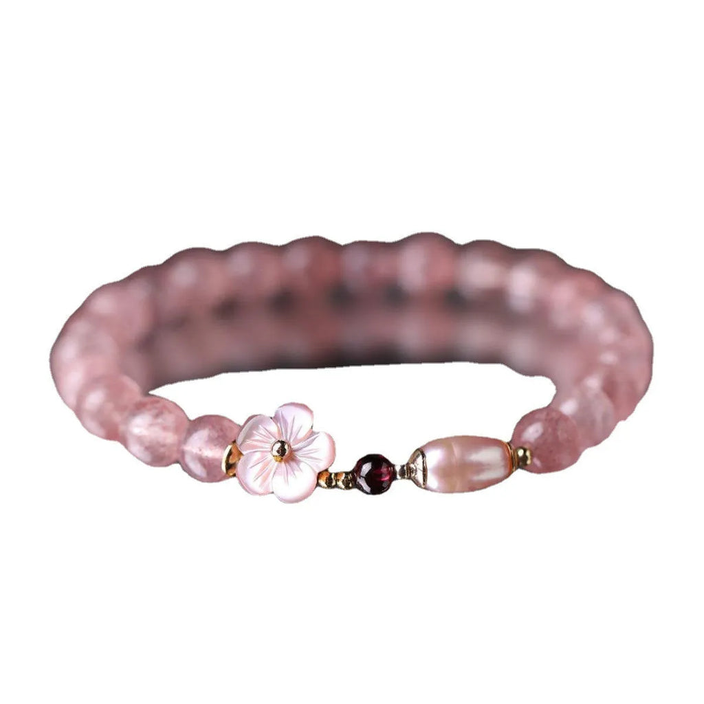 Strawberry quartz peach blossom bracelet with natural pink crystal flower beads for casual wear.
