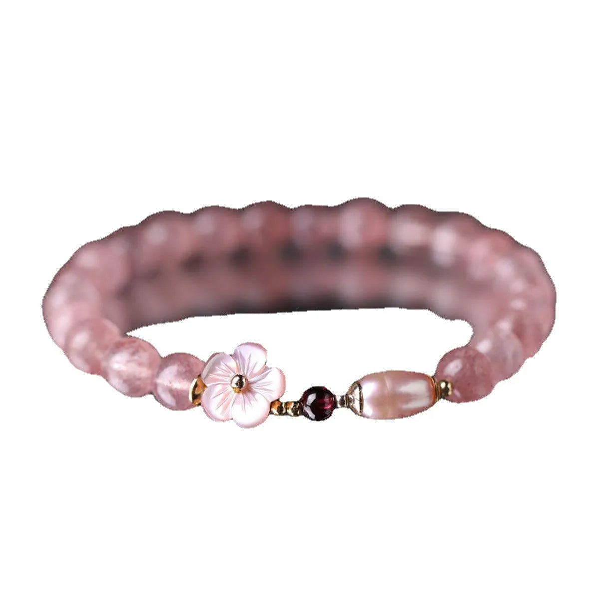 Strawberry quartz peach blossom bracelet with natural pink crystal flower beads for casual wear.