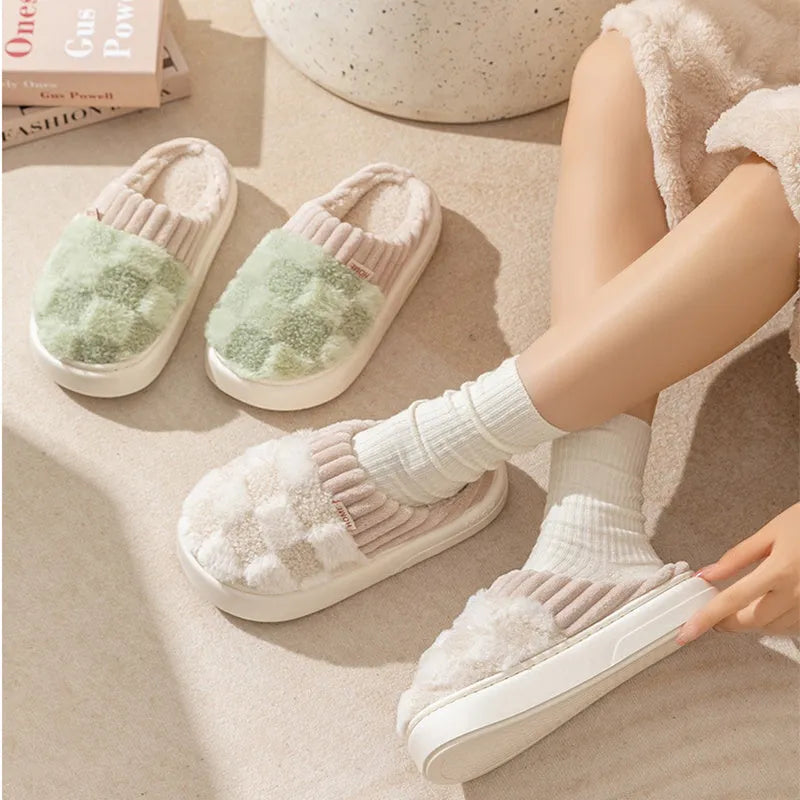 Women's plaid patterned plush slippers with coral velvet upper and non-slip PVC sole in coffee colour.
