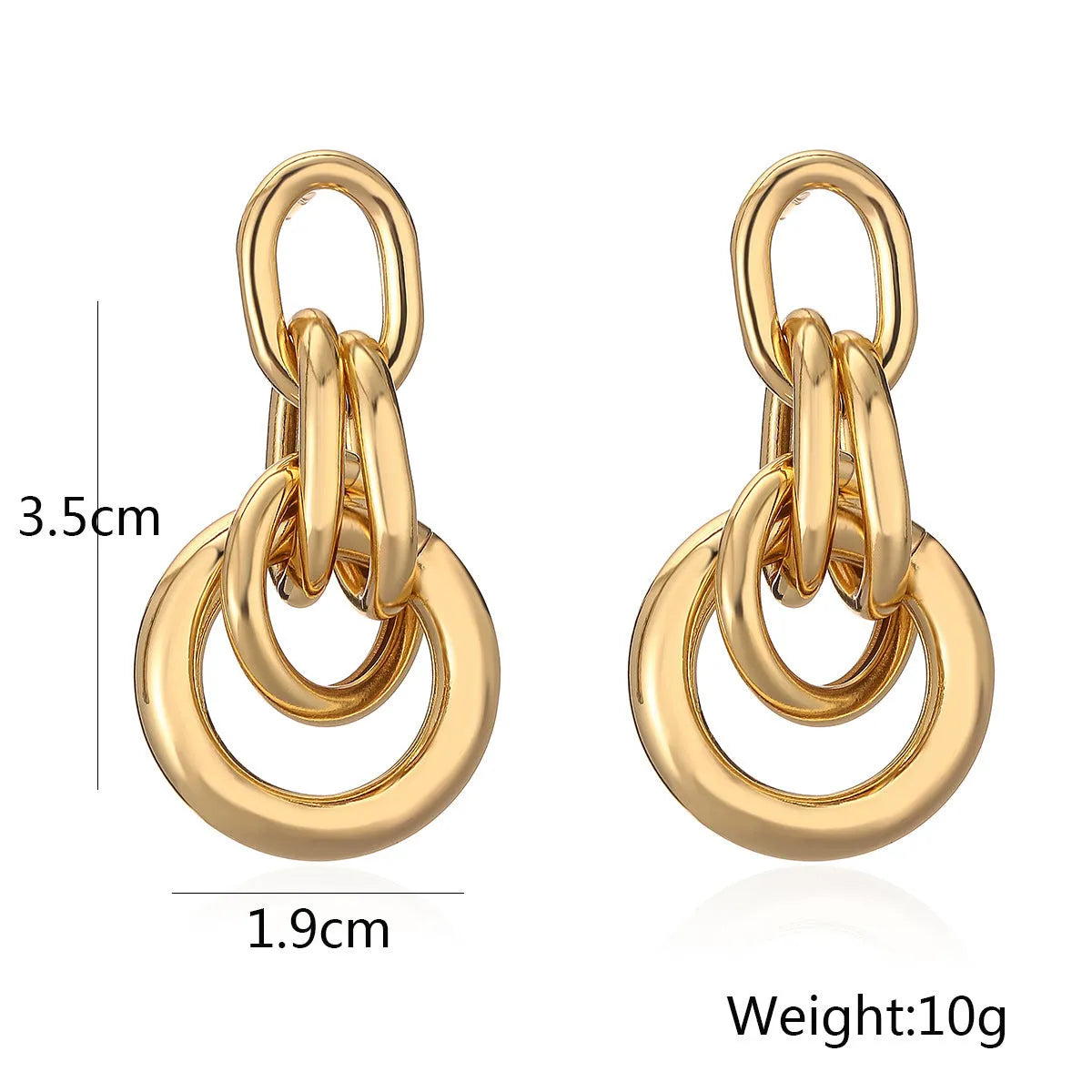 Geometric gold-coloured copper earrings with irregular design elements and high-profile construction