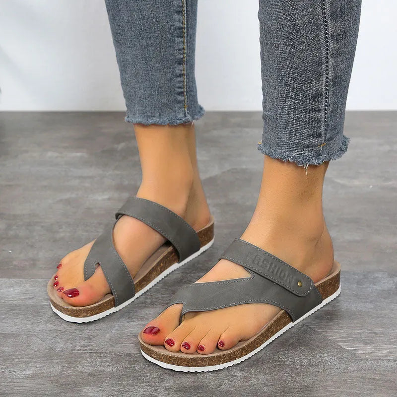 Flat toe ring flip-flops in blue with thick foam sole and artificial PU upper