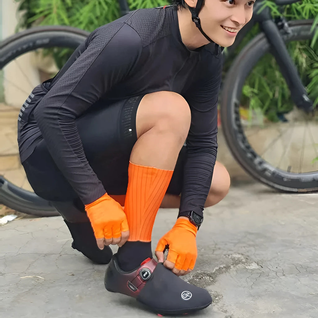 A pair of athletic cycling and running socks in a moisture-wicking fabric blend on a grey background.