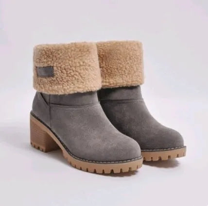 Women's mid-tube suede snow boots in black with a thick heel and waterproof platform.
