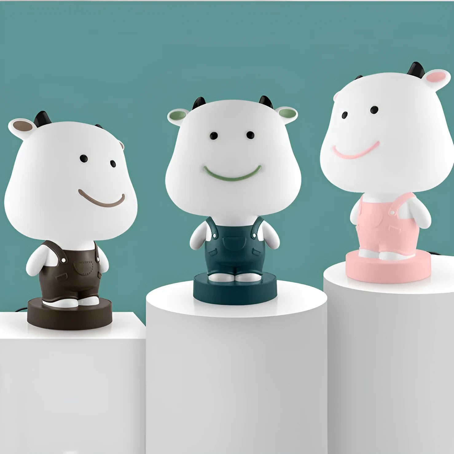 Cartoon animal table lamp in bear, cow, rabbit, or tiger design with plastic shade and LED light.