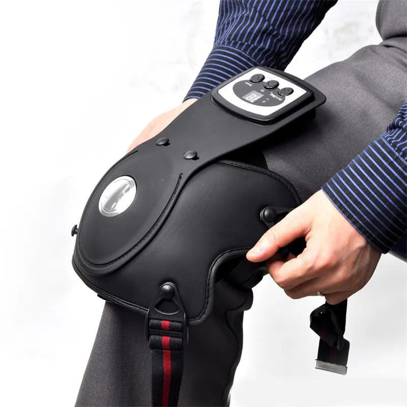 Portable infrared knee and shoulder massager unit with adjustable temperature control and two fabric pads.