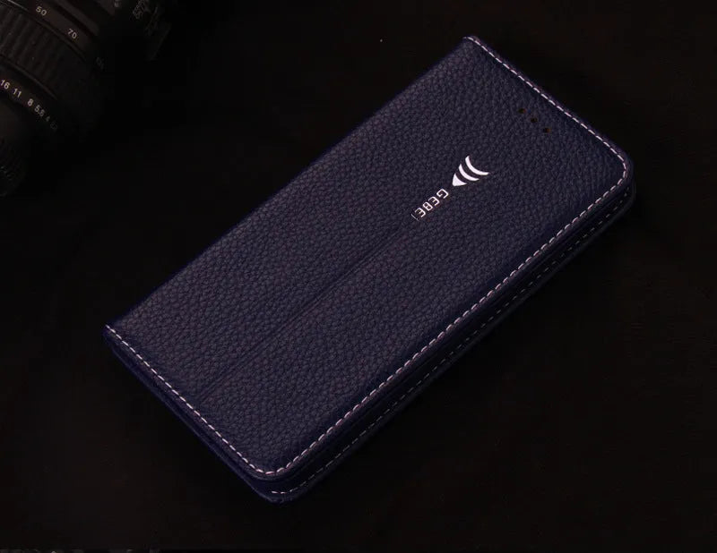 Black PU leather wallet-style case open to show card slots, next to an iPhone.