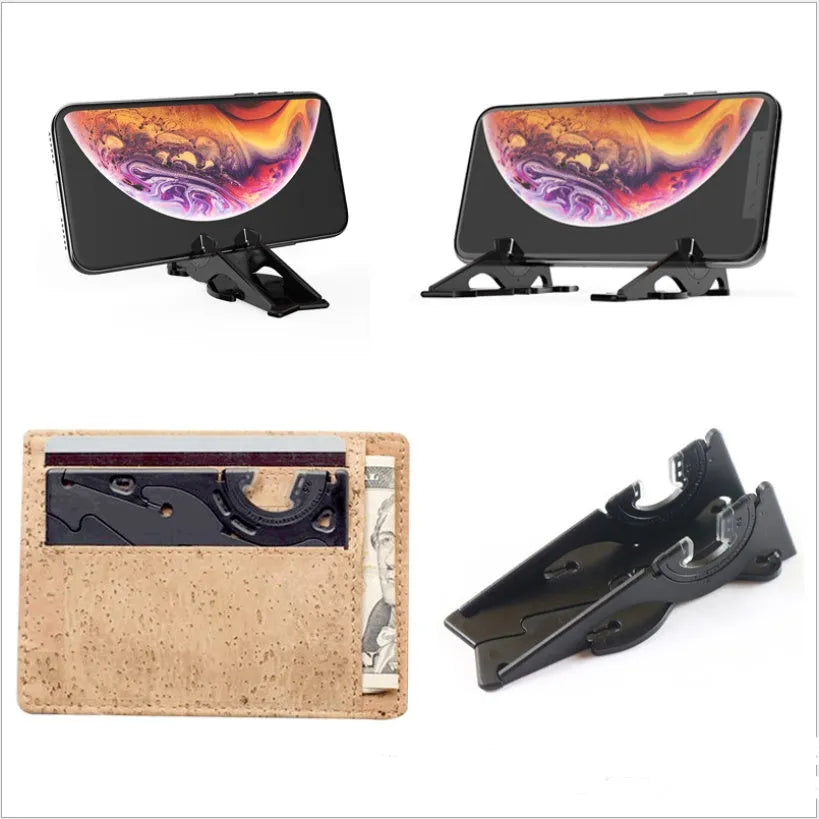 Black plastic card type mobile phone holder for desktop use on a wooden desk