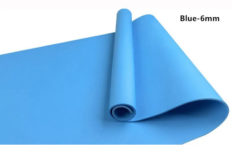 EVA fitness yoga mat in blue, showing its texture and thickness, rolled up with its OPP storage bag.