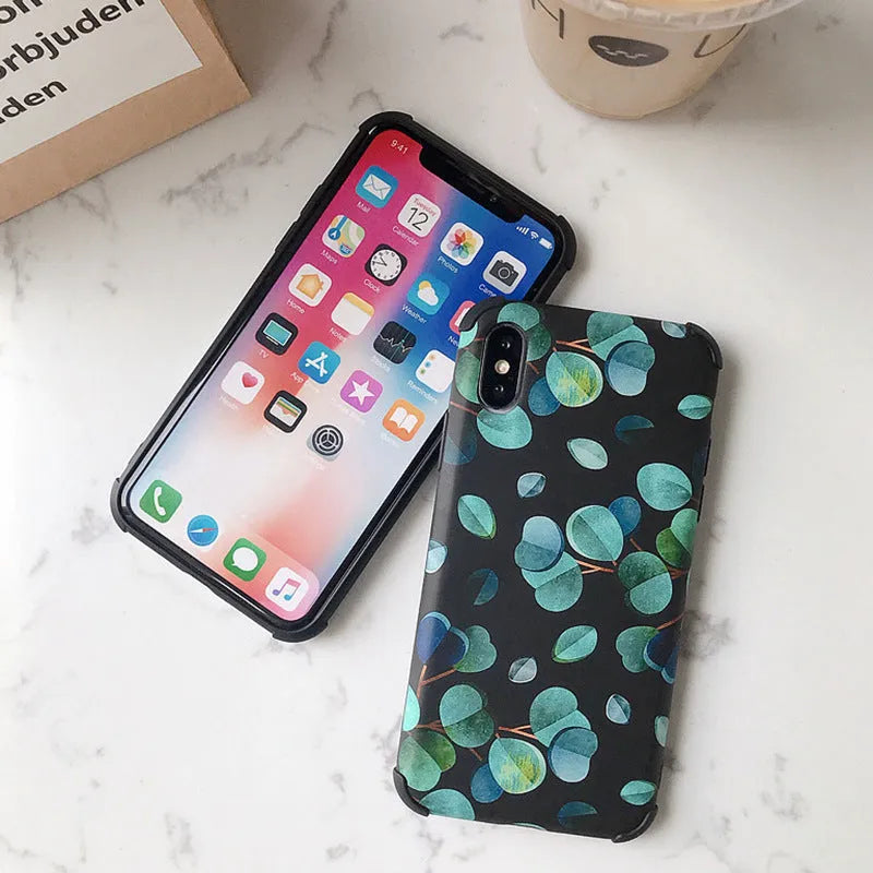 Black silicone iPhone case with a raised leaf pattern design on the back.