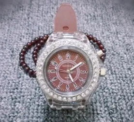 Women's LED luminous quartz watch with round dial, silicone strap, and luminous display features
