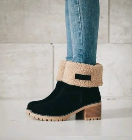 Women's mid-tube suede snow boots in black with a thick heel and waterproof platform.