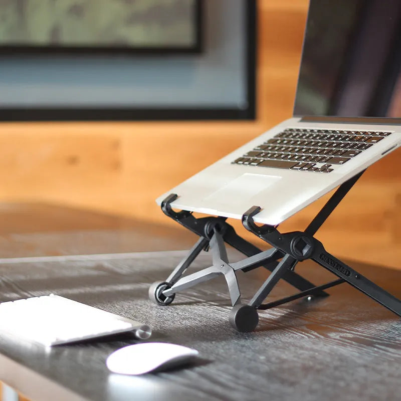 Black folding portable laptop stand with adjustable height, shown folded to 35.4cm size.
