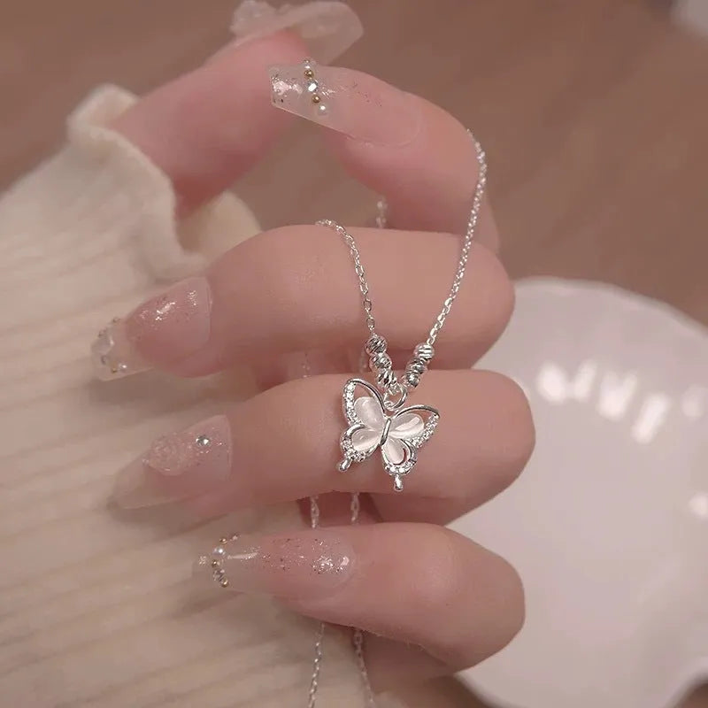 Women's silver butterfly necklace with square line pendant on cross chain