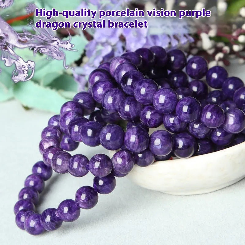 Natural transparent charoite crystal bracelet with platinum elements on a wrist.