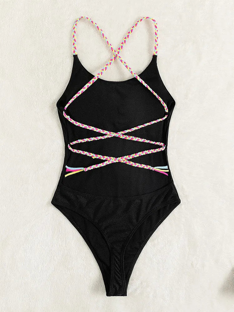 Black women's one-piece swimsuit with backless design and sleeveless construction