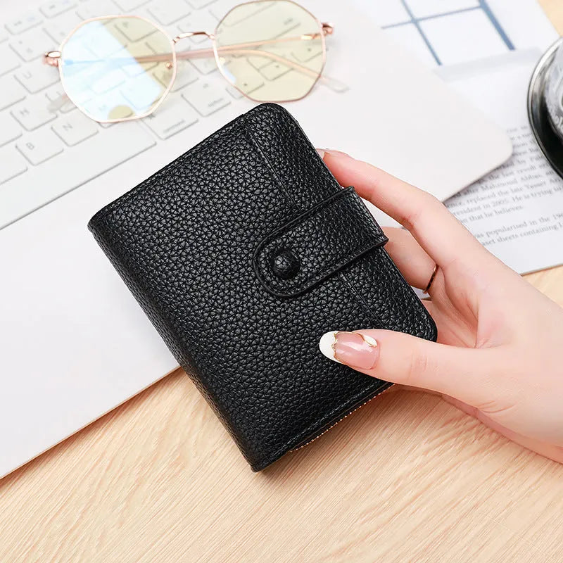 Ladies short PU wallet with lychee pattern in beige, pink, black, or red colour.