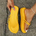 A pair of thick-soled flip-flops in a herringbone strap design, shown in one of six available colours.