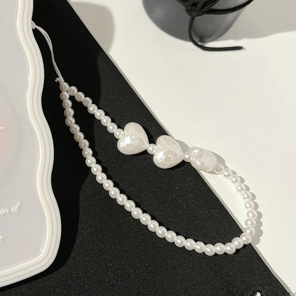 Transparent iPhone case with a three-dimensional ice-through bow decoration on the back.