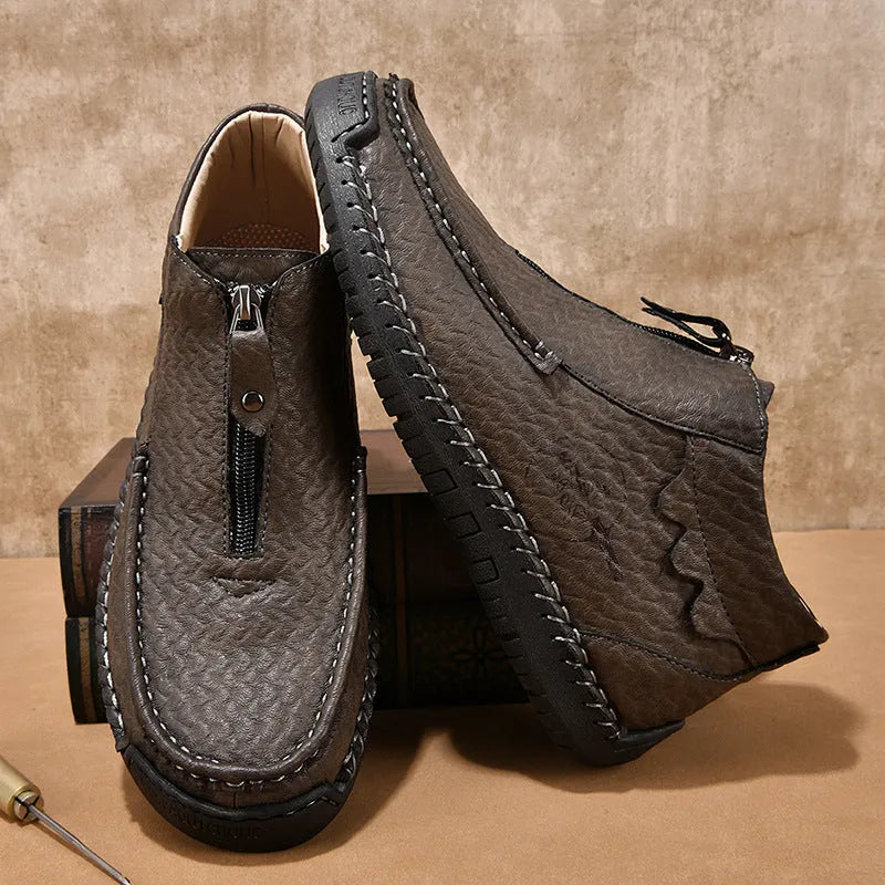 Men's solid colour slip-on loafers with round toe and rubber sole, shown in black, brown, and grey.