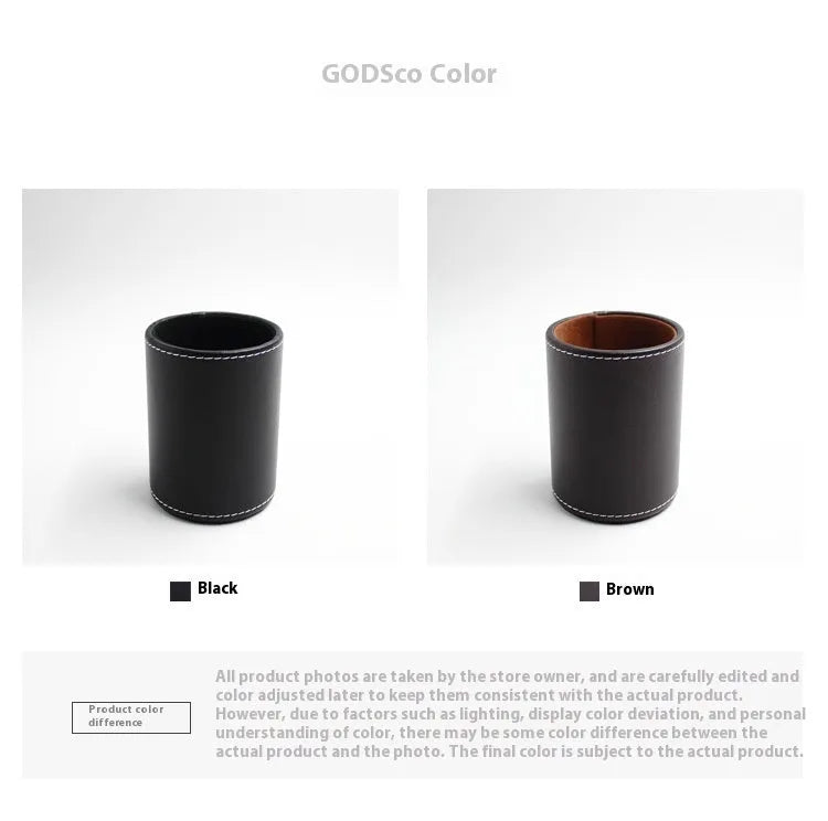 Black leather round pen holder with cylindrical shape on a desk